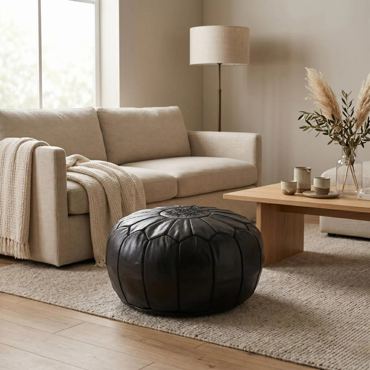 Black Moroccan leather pouf in a modern Australian living room