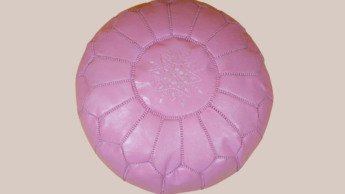 Authentic top view of a blush pink Moroccan leather pouf