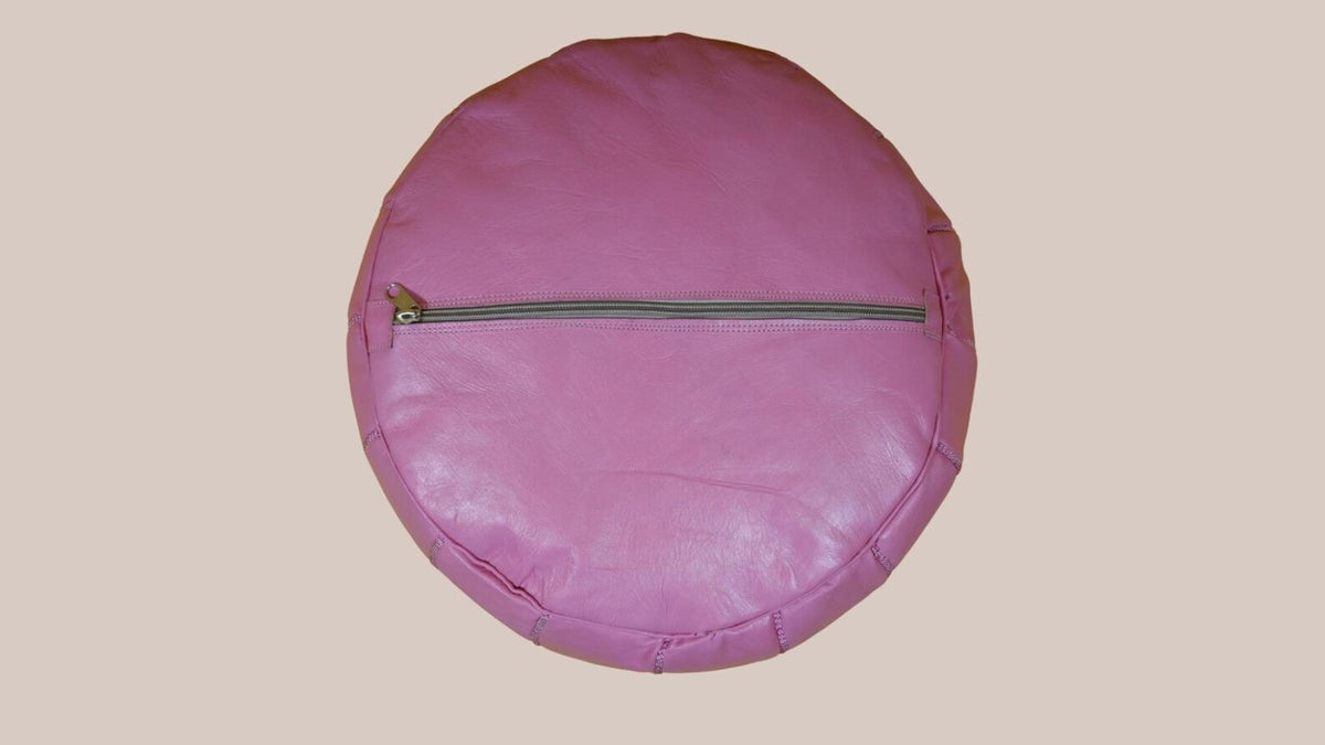 Concealed base zip on a blush pink Moroccan leather pouf