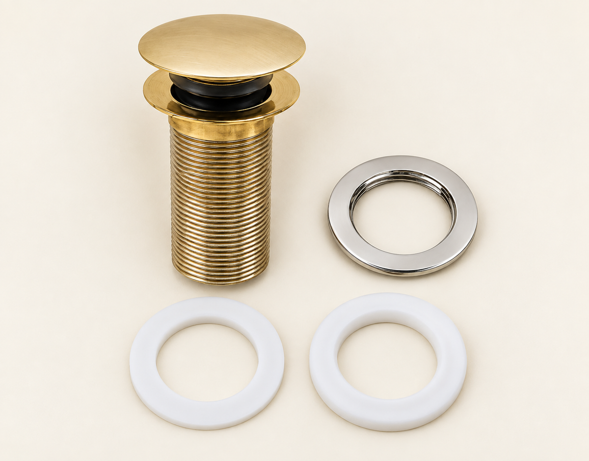 Components of handcrafted unlacquered brass push-up basin drain