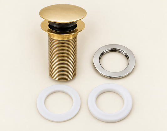 Components of handcrafted unlacquered brass push-up basin drain