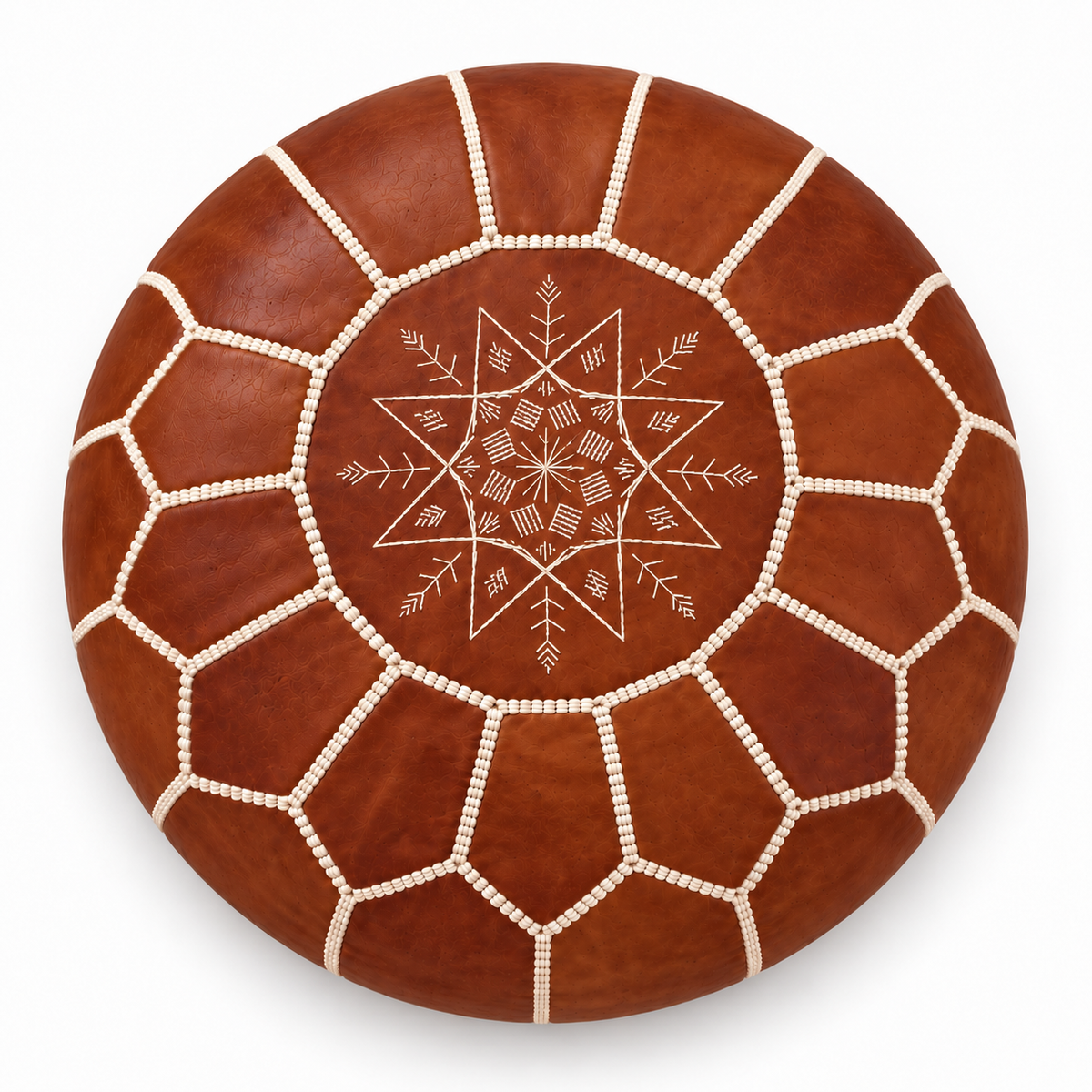 Top view of a cognac brown Moroccan leather pouf on a white background