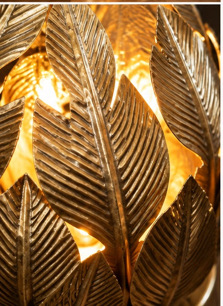 Close-up of handcrafted brass leaf detailing