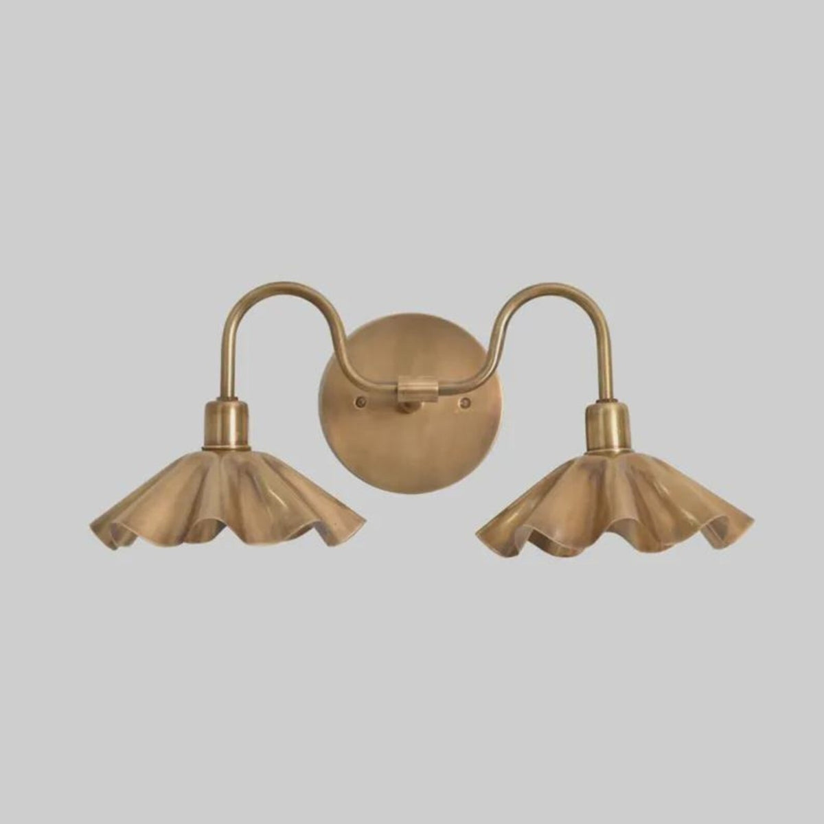 Front view of double petal solid brass wall sconce