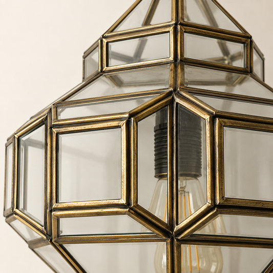 Close-up of handcrafted antique brass frame and clear glass panels