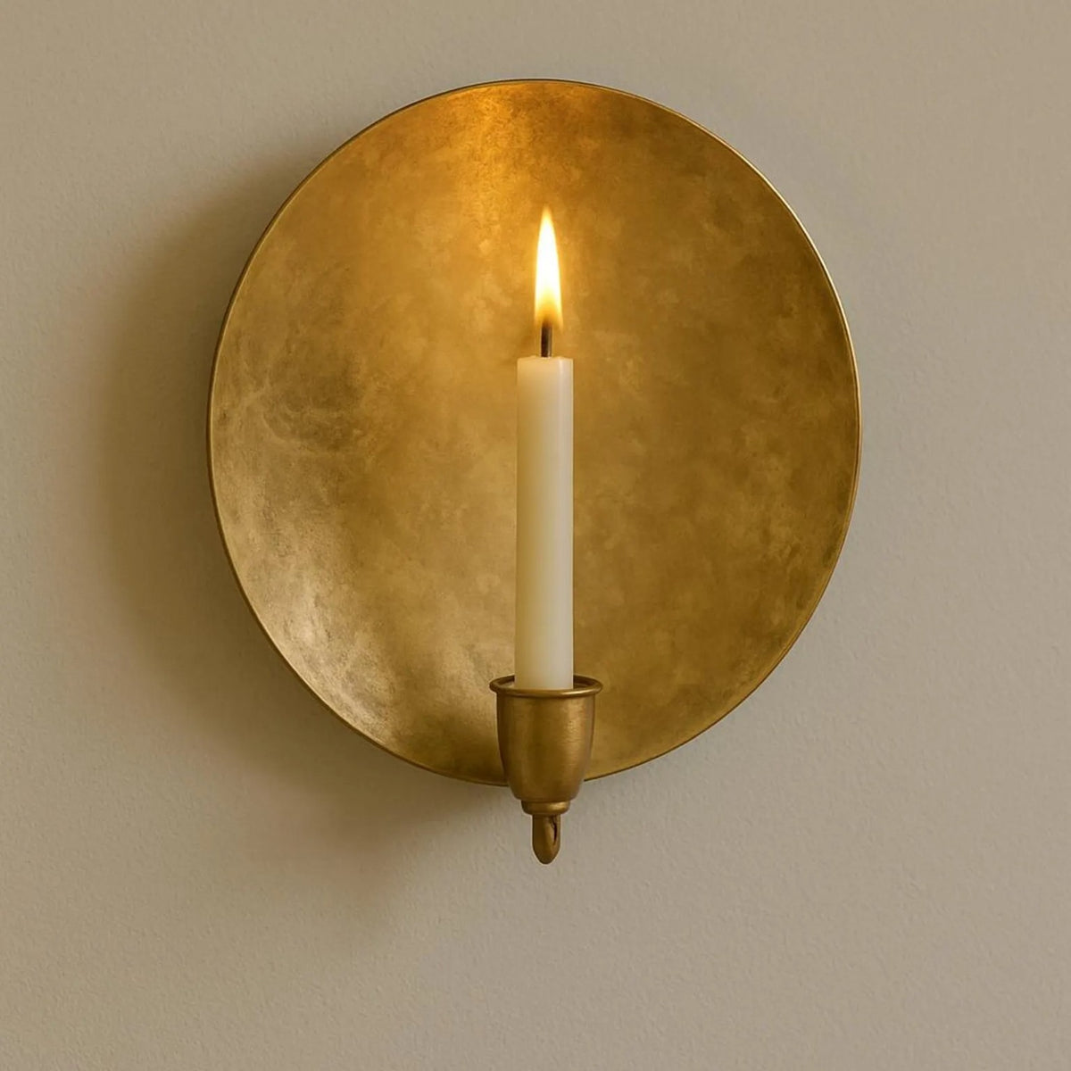 Handmade round Moroccan brass wall candle sconce with taper candle