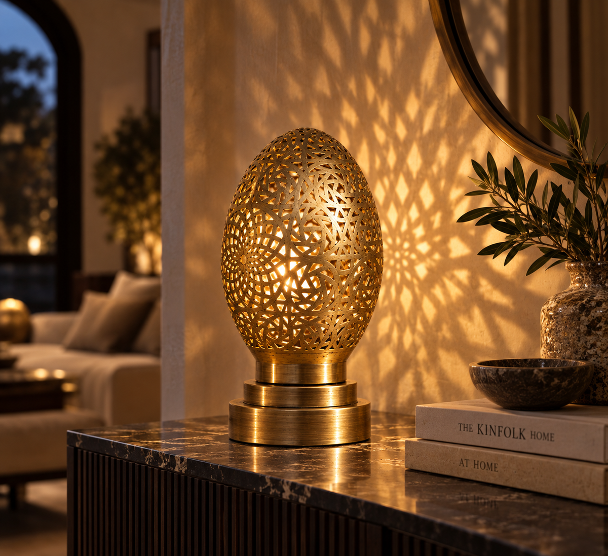 Moroccan pierced brass egg table lamp on luxury console with patterned light