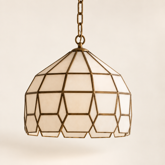 Three-quarter side view of Moroccan brass and milk glass pendant