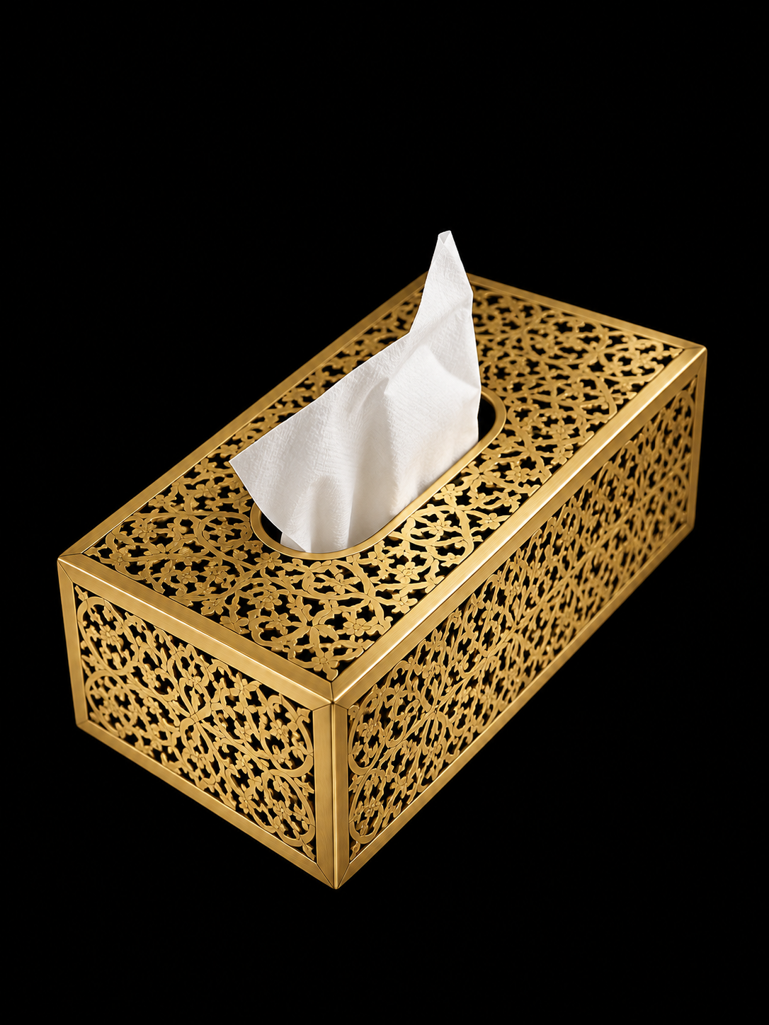 Handcrafted Moroccan pierced brass tissue box cover on clean black background