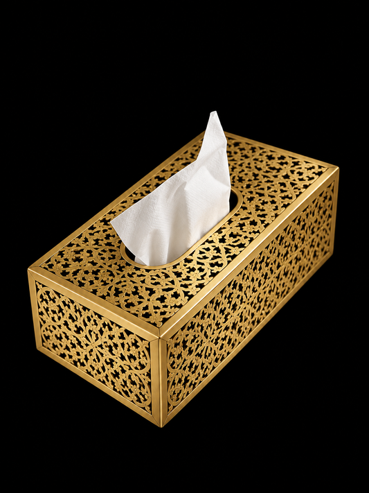 Handcrafted Moroccan pierced brass tissue box cover on clean black background