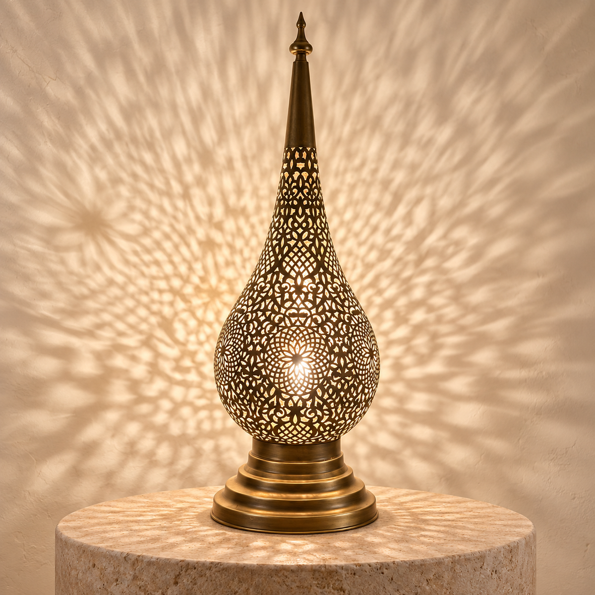 Handcrafted Moroccan pierced brass teardrop table lamp illuminated