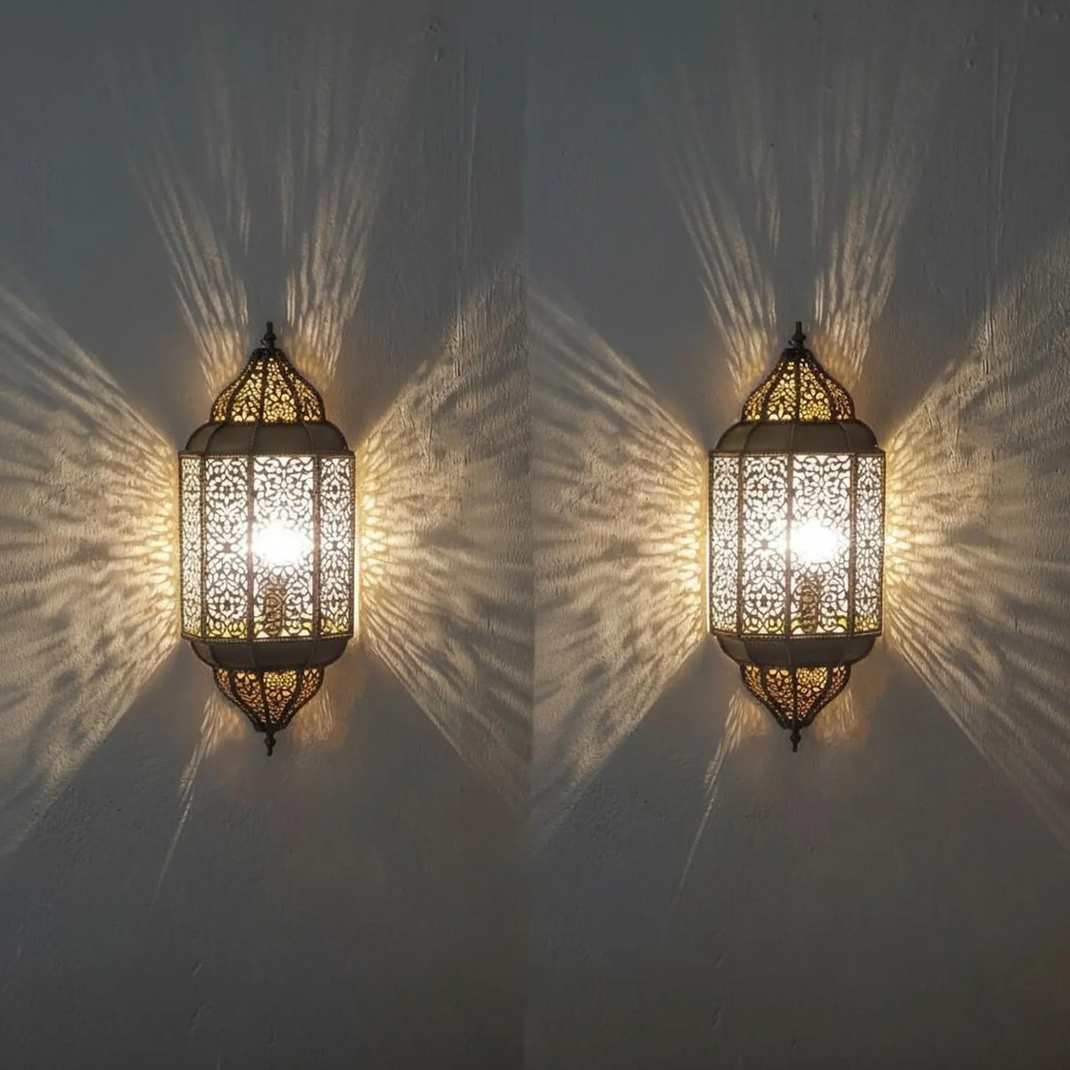 Pair of Moroccan sconces casting patterned light