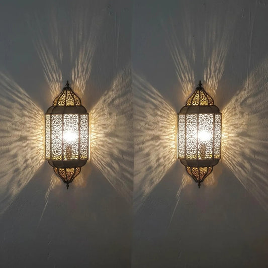 Pair of Moroccan sconces casting patterned light