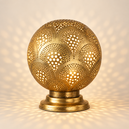 Handcrafted Moroccan pierced brass globe table lamp illuminated