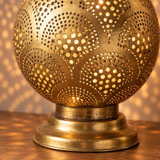 Close-up of hand-punched brass pattern and base