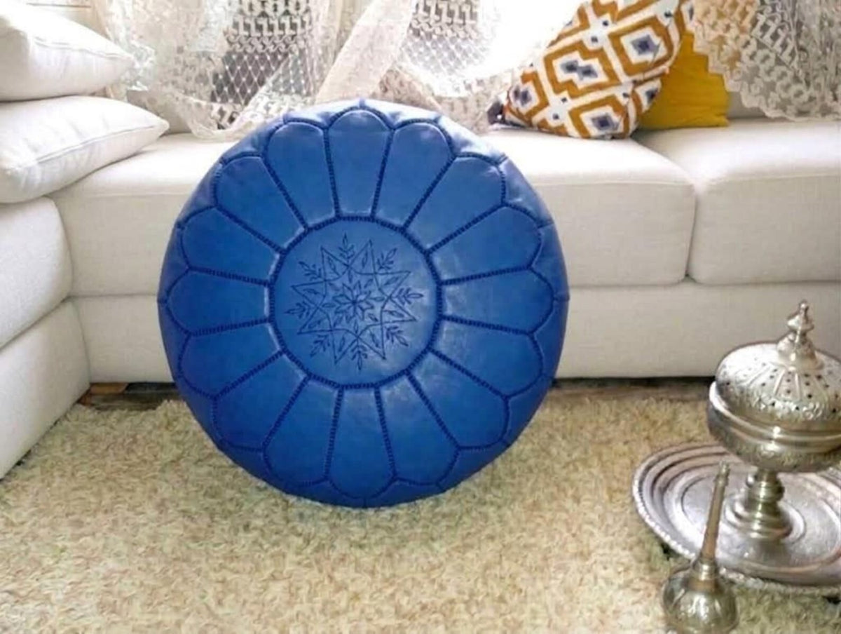 Royal blue Moroccan leather pouf in a living room