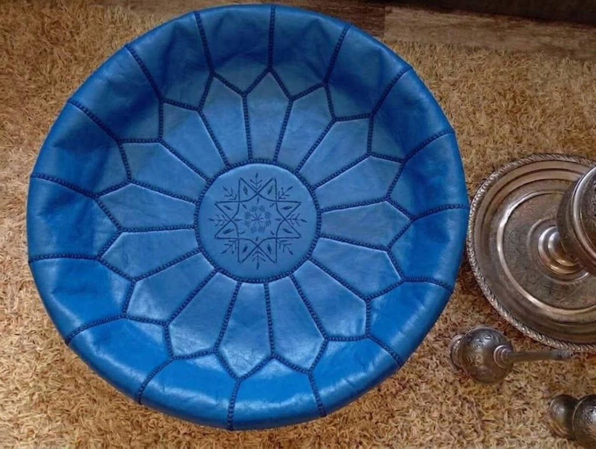Authentic top view of a royal blue Moroccan leather pouf