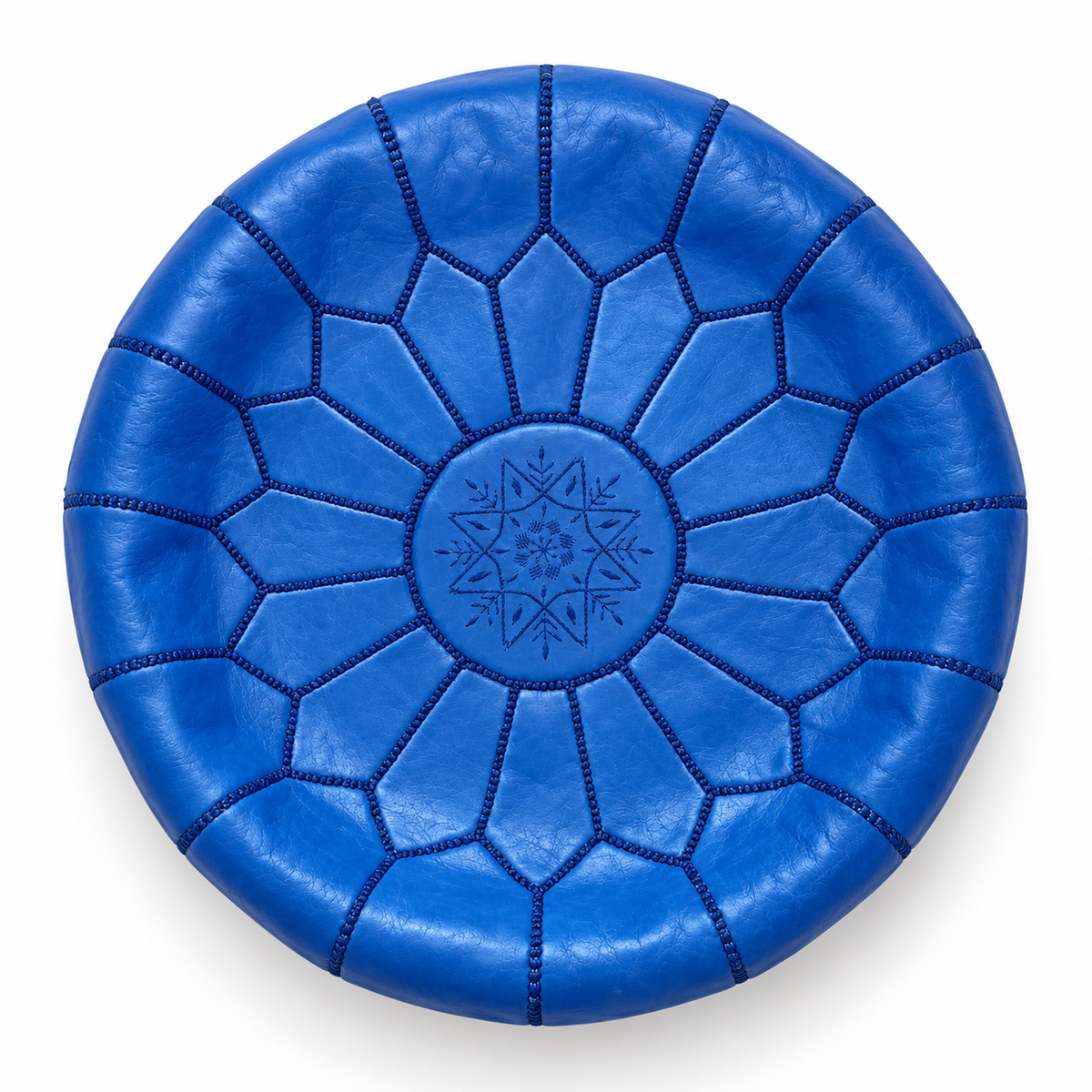 Top view of a royal blue Moroccan leather pouf on a white background