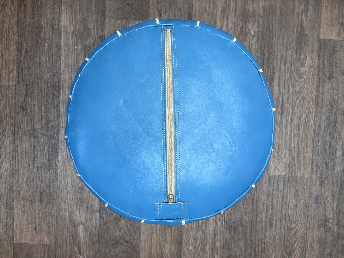 Underside zipper of sky blue Moroccan leather pouf cover