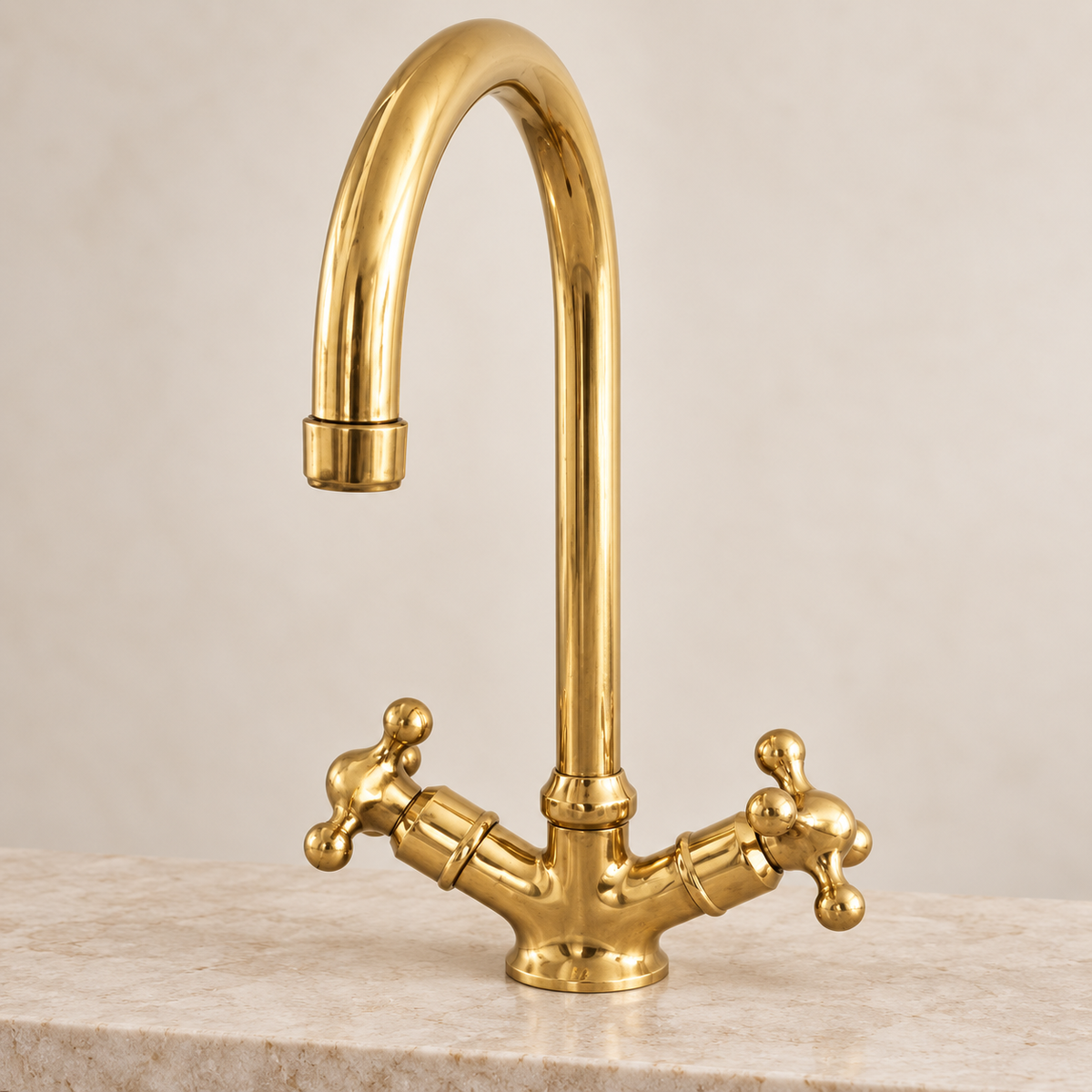Handcrafted unlacquered brass gooseneck faucet with traditional cross handles