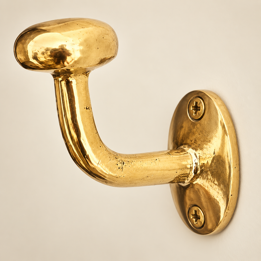 Handcrafted unlacquered solid brass wall hook close-up