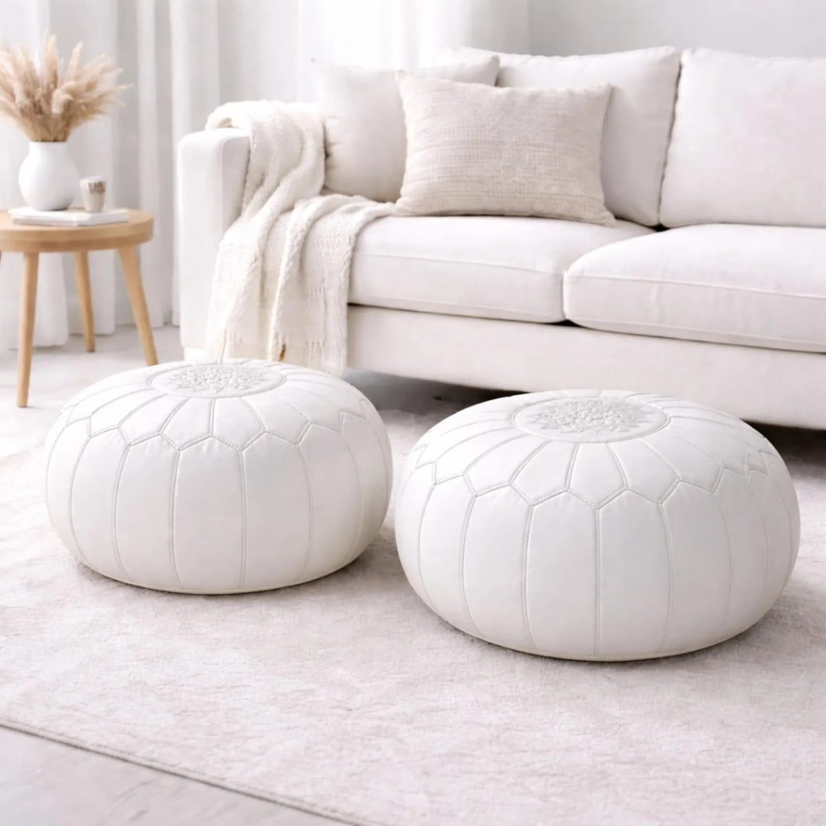 Pair of white Moroccan leather poufs in a bright Australian living room